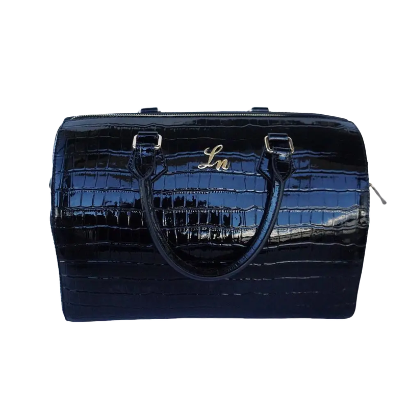 Black patent croc leather duffle bag with gold hardware and stitched handles.