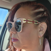 Woman wearing the Laurice Noire Ashley polarized sunglasses inside a vehicle