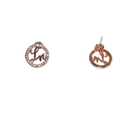Pair of rose gold earrings with circular designs on a white background